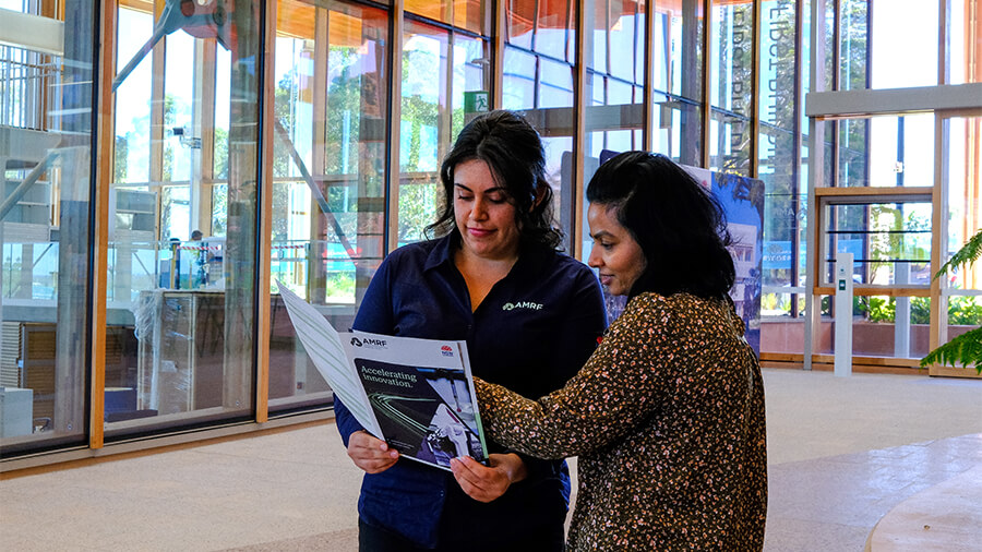 Two women looking at a brochure
