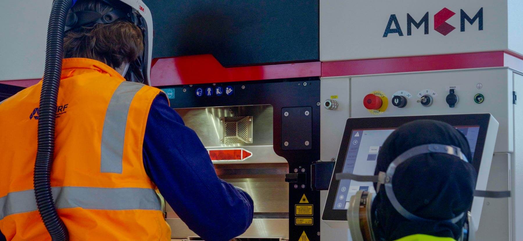Workers at a machine